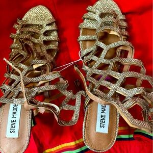 Steve Madden gold shoes. Bought for Christmas one year and never used. NWT